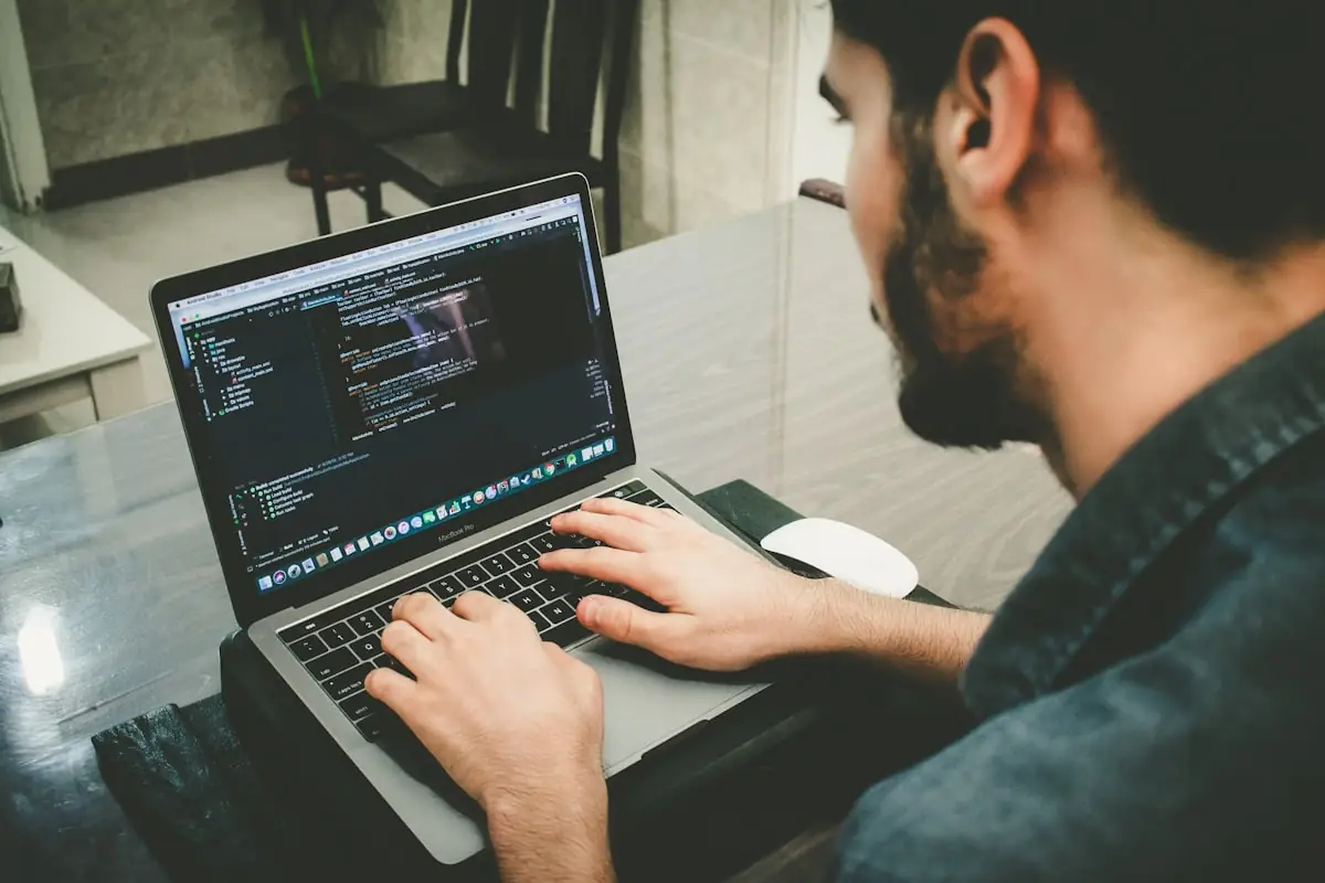A developer testing code on a laptop