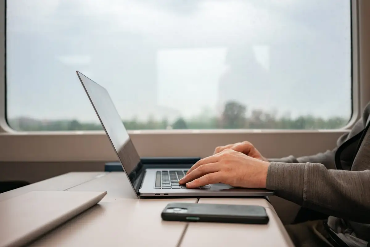 A consultant working at a laptop during a diagnostic