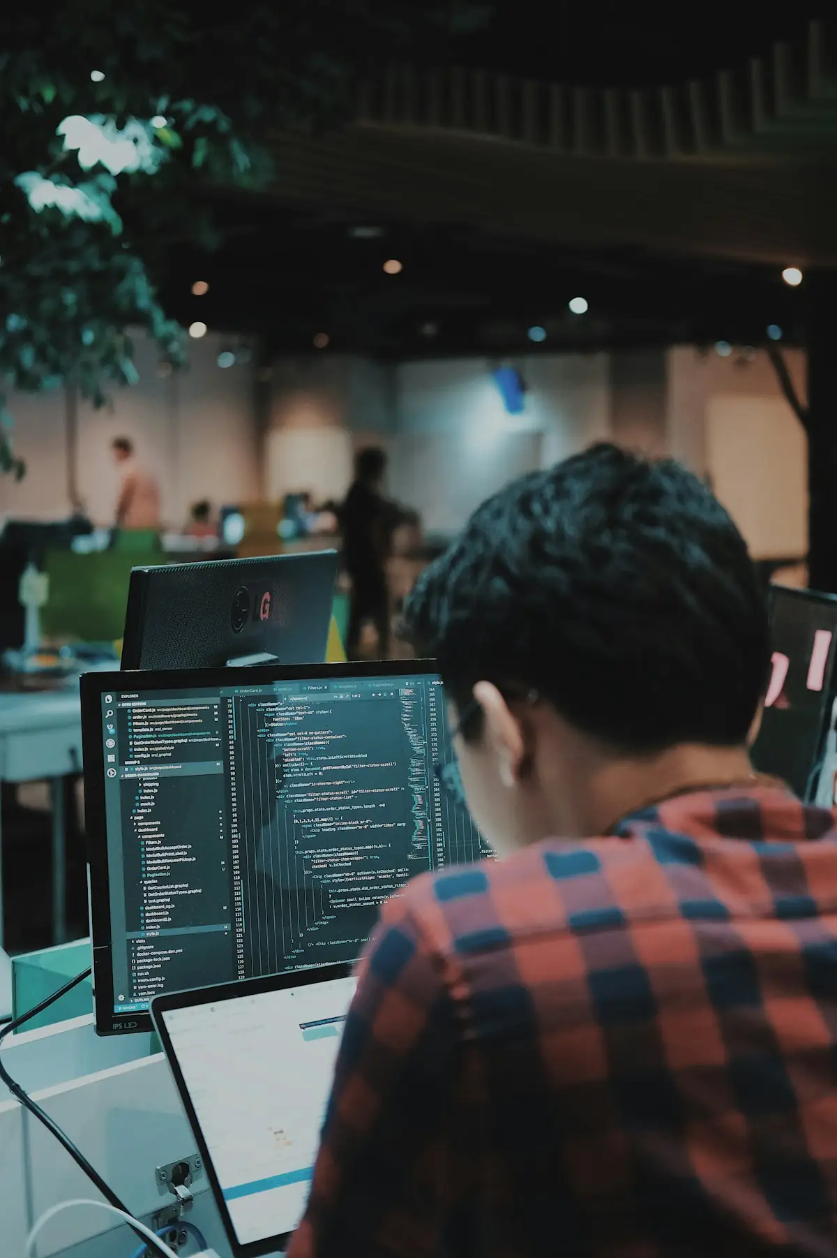 An engineer reviewing code at a workstation