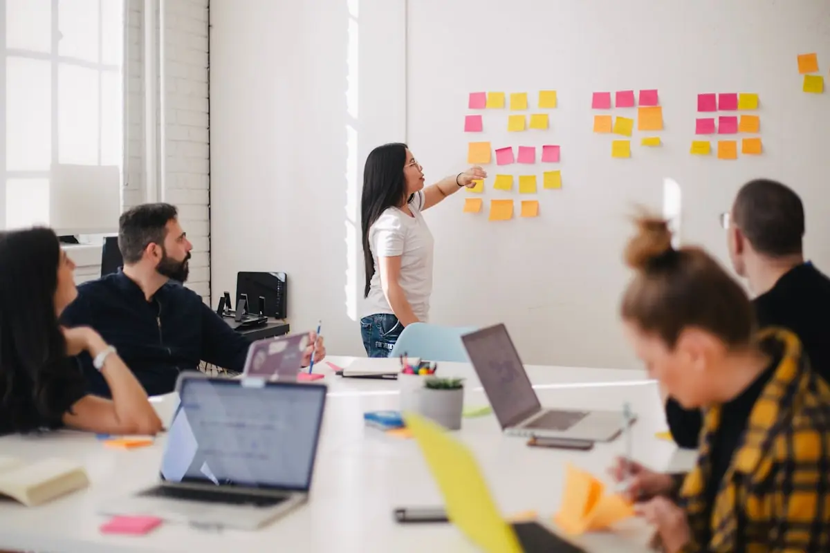 A team mapping a process together on a wall of notes